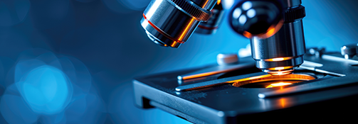 Close up of a darkly lit mircroscope