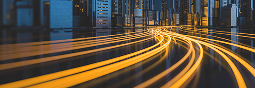 Fiber lights joining together and entering city at night